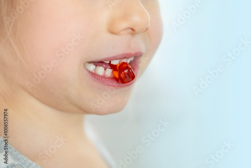 close-up preschool child, girl 5 years old wants eat gelatinous sweets, gummy bear, kid has good appetite, happy childhood, balanced diet, sweet life, unhealthy food, halal food