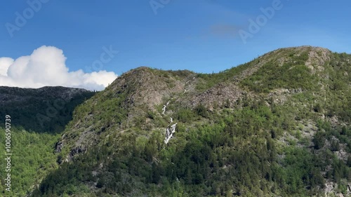 Steinbuktvannet, Kviby, Alta Municipality, Finnmark, Norway - river mountain slope formed by glacier melted snow flows into valley as waterfall photo