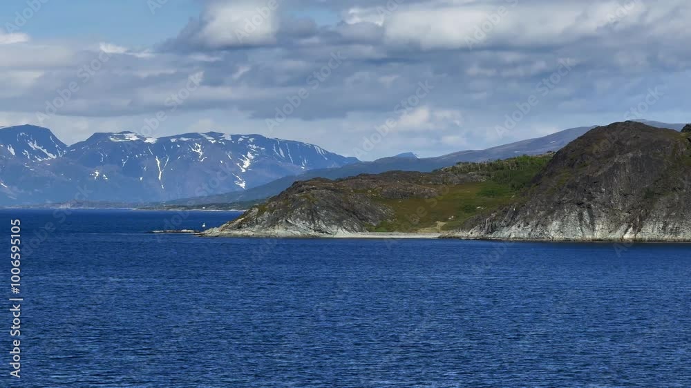 Altenesbukta, Kviby, Alta Municipality, Finnmark, Norway - slowly cruising past the bay at a sunny day while leaving the fjord Altenesbukta, Kviby, Alta Municipality, Finnmark, Norway - slowly cruising past the bay at a sunny day while leaving the fjord