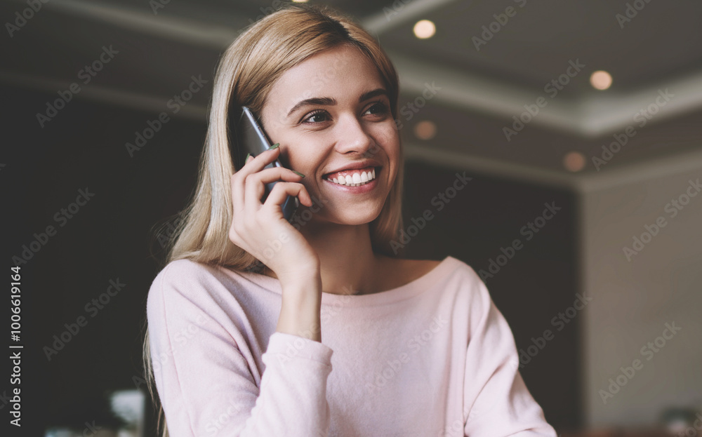 Positive female student calling to friend for discussing details about university task for course work, happy woman using mobile application for making conversation during learning in classroom Positive female student calling to friend for discussing details about university task for course work, happy woman using mobile application for making conversation during learning in classroom