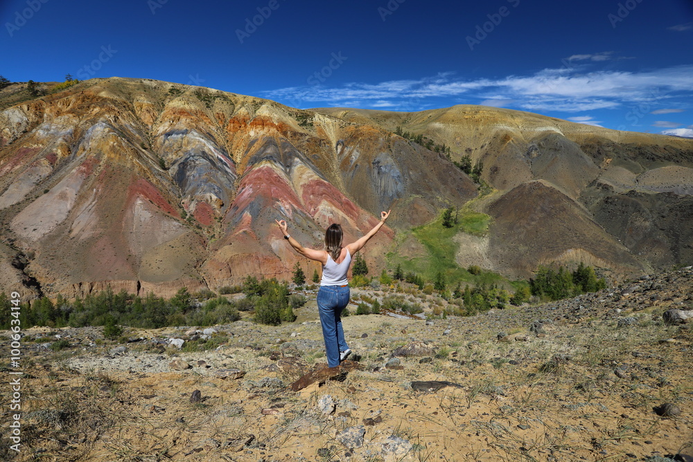 Naklejka premium Altai Republic. Tourists pose against the background of Martian and Moon landscapes – deserted area with canyons.