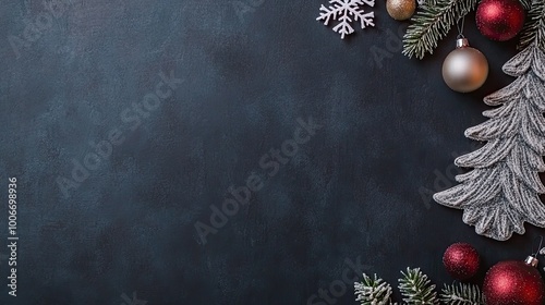 A sophisticated Christmas display features a three-dimensional tree with golden embellishments and hanging snowflakes, set against a dark blue backdrop for a festive feel
