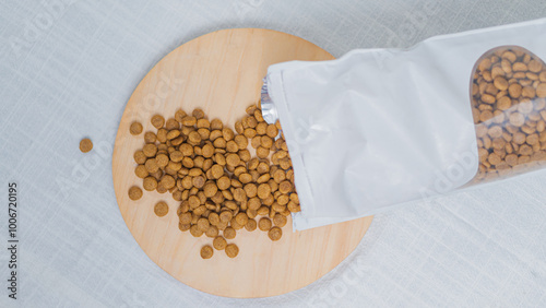 Pouring Pet Food on Wooden Board