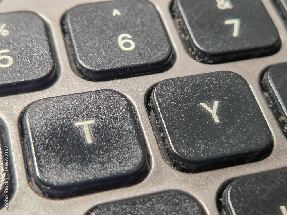 Close-up of a keyboard focusing on the T and Y keys, showcasing modern technology and design in everyday life.