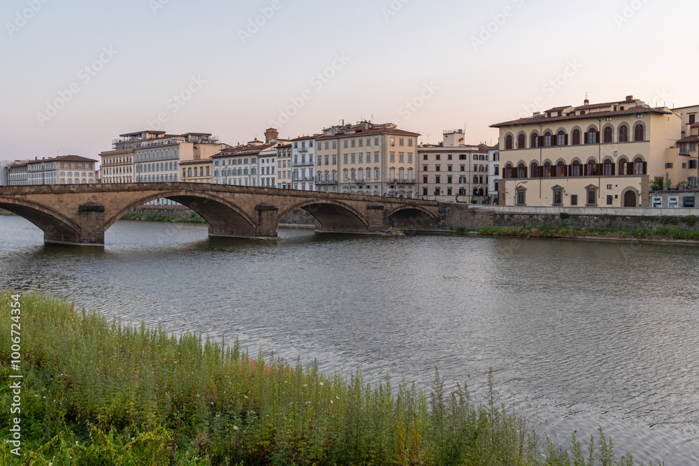 Fototapeta premium Sunrise on Arno River and Carraia Bridge. Florence, Tuscany 