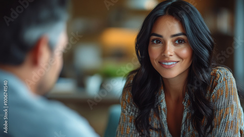  beautiful 36 year old woman with black hair in a therapy session with a chubby average looking man.  photo