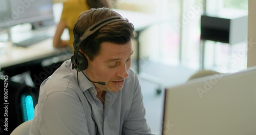 Business Man with Headset on a Video call in an Office, Telemarketing, Call centre