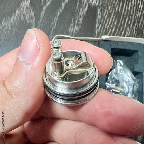 hand holding a metal can