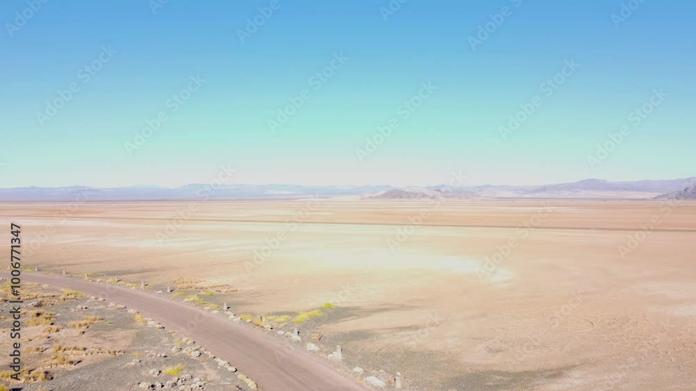 Drone across Nevada dry lake bed on a sunny summer day Drone across Nevada dry lake bed on a sunny summer day