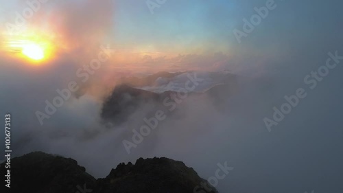 Aerial footage of smoky, foggy weather at mountains of Pyrenees in Ibones de Anayet, Aragón, Spain during morning. photo