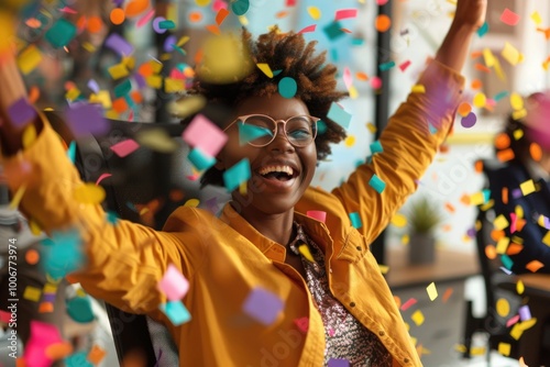 A woman wearing a yellow jacket and glasses stands surrounded by colorful confetti, perfect for party or celebration scenes