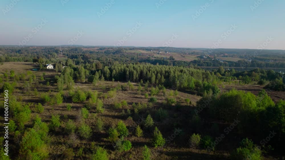 rural landscape of Polish countryside with fields trees and small houses rural landscape of Polish countryside with fields trees and small houses