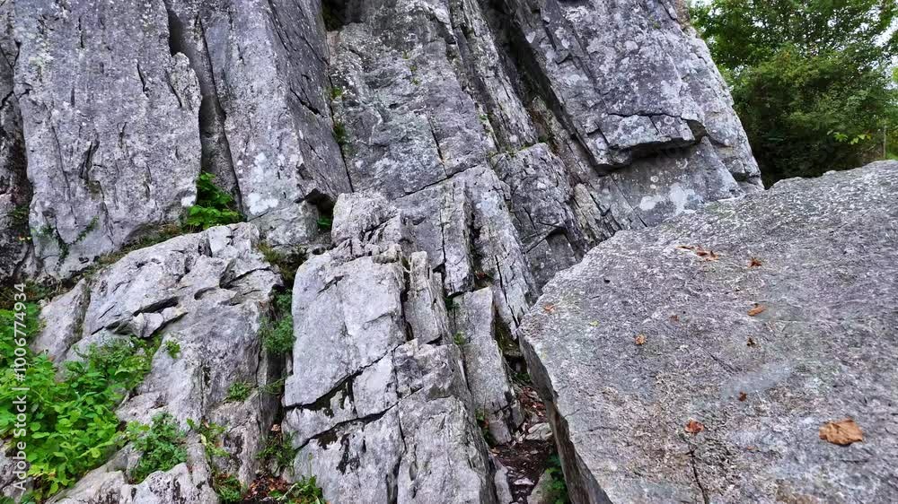 Close-up view from the cave of Lorette-Rochefort cliffs formation in Erve valley, Mayenne, France. Close-up view from the cave of Lorette-Rochefort cliffs formation in Erve valley, Mayenne, France.