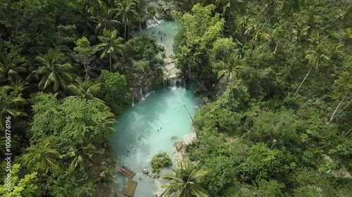 Aerial footage of Cambugahay Waterfalls with vibrant turquoise pools and surrounding tropical forest in Siquijor photo