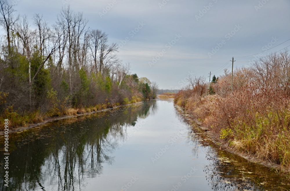 Holland Marsh Canal on a cloudy fall day in Ontario, Canada. The canal system is 28 km long. Holland Marsh Canal on a cloudy fall day in Ontario, Canada. The canal system is 28 km long.