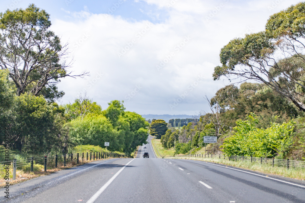 Long Open Highway Stretching Across Peaceful Countryside Long Open Highway Stretching Across Peaceful Countryside