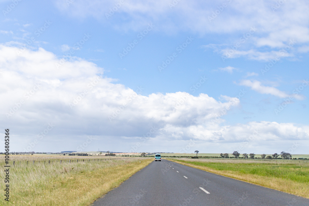 Long Open Highway Stretching Across Peaceful Countryside