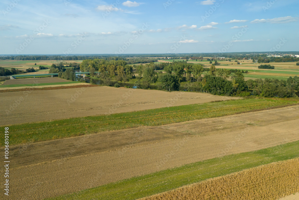 Aerial view of beautiful rural fields in vibrant colors under a clear sky Aerial view of beautiful rural fields in vibrant colors under a clear sky