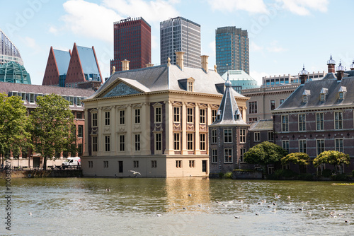 Mauritshuis museum and parliament building in The Hague. Office buildings and skyscrapers in the background. photo