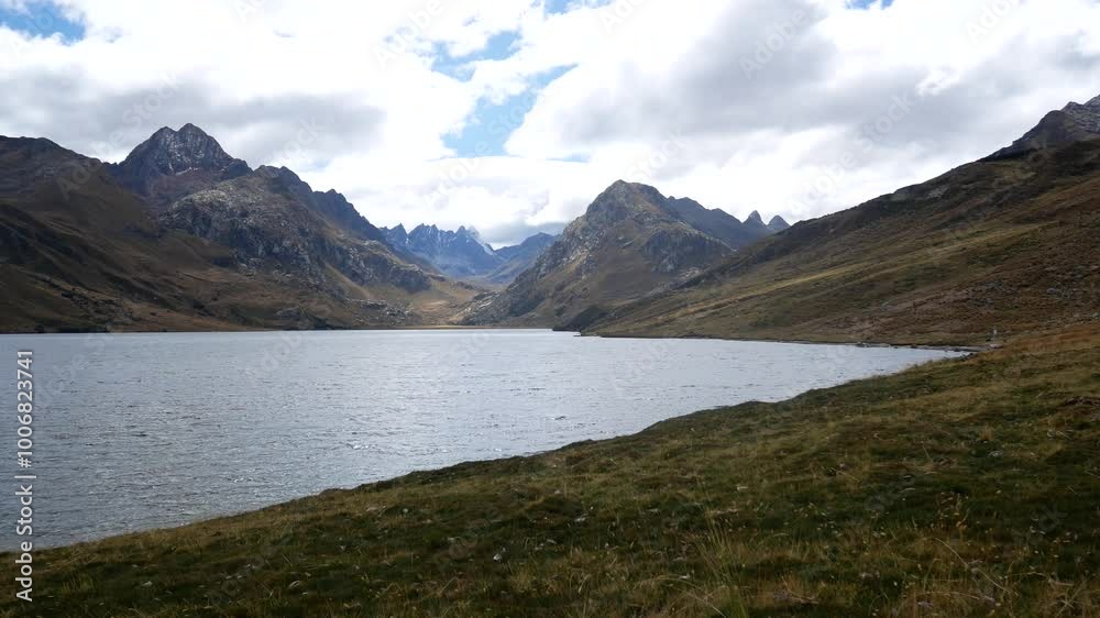 Waters of Glacial Origin in the Cordillera Blanca in Ancash, Peru, Known as Querococha Lagoon, Dark Green in Volor and with Some Polylepis Groves Around it Waters of Glacial Origin in the Cordillera Blanca in Ancash, Peru, Known as Querococha Lagoon, Dark Green in Volor and with Some Polylepis Groves Around it