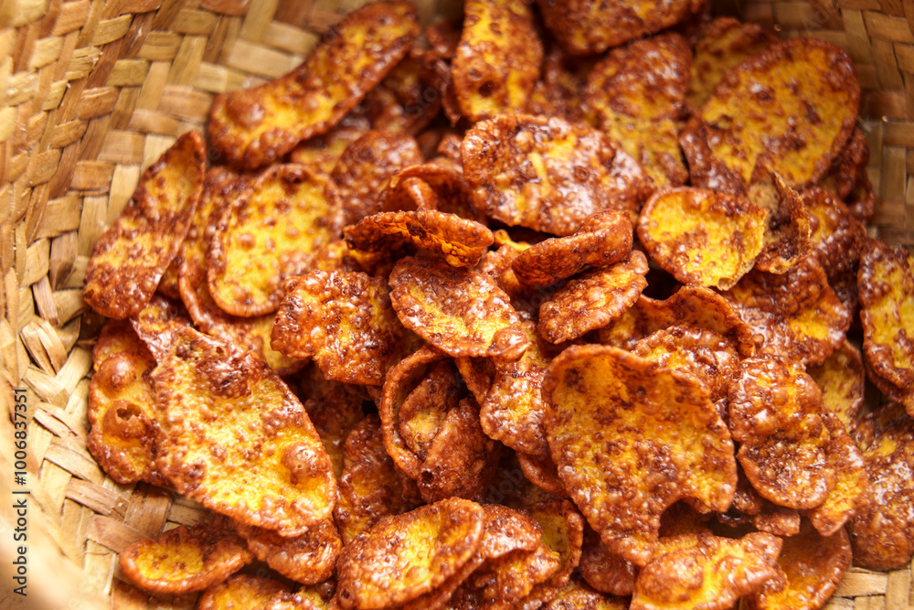 Organic crispy corn flakes with chocolate in rustic wicker bowl. Macro shot