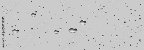 Rain transparent drops flow down the glass.Realistic wet condensation texture.Fresh water splash effect on the surface.Liquid spreading droplet shapes.