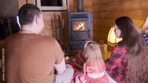 family, young couple on evening enjoying intimate festive atmosphere, Relaxing by Fireplace, Family Time by Fire, Christmas season, , Christmas coming, Cozy Christmas Eve, Evening by Hearth photo