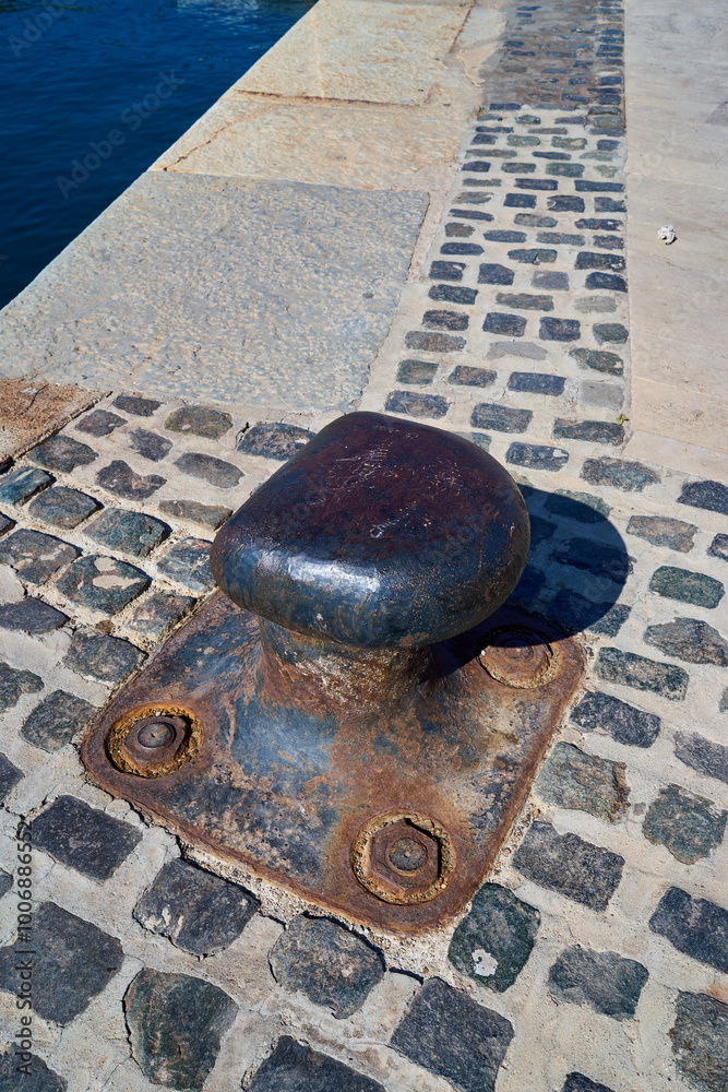 Old marine bollard in the harbour Old marine bollard in the harbour