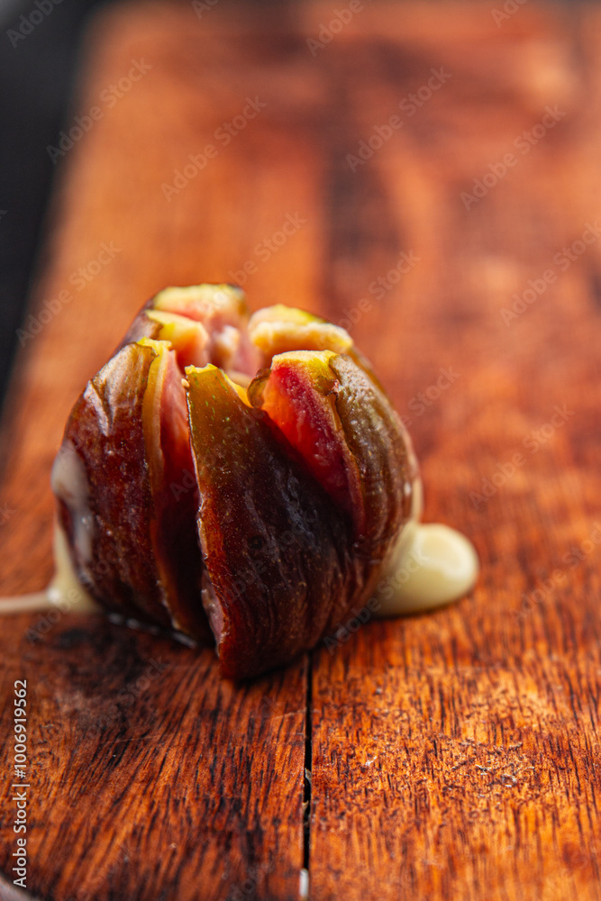 figs baked with cheese camembert or brie fresh meal food snack on the table copy space food background rustic top view keto or paleo diet vegetarian vegan food