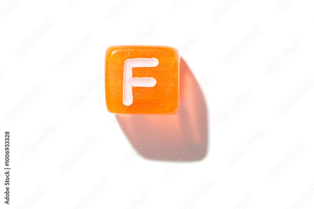 Orange cube with white letter f casting shadow on white background. Orange cube with white letter f casting shadow on white background.