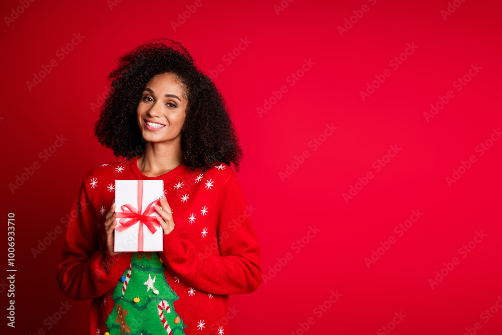 Photo of charming attractive girl wear stylish ugly ornament sweater festive event sale empty space isolated on red color background Photo of charming attractive girl wear stylish ugly ornament sweater festive event sale empty space isolated on red color background