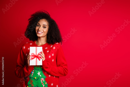 Photo of charming attractive girl wear stylish ugly ornament sweater festive event sale empty space isolated on red color background