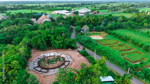 A Thai temple in Prakhon Chai district is surrounded by a verdant garden. photo