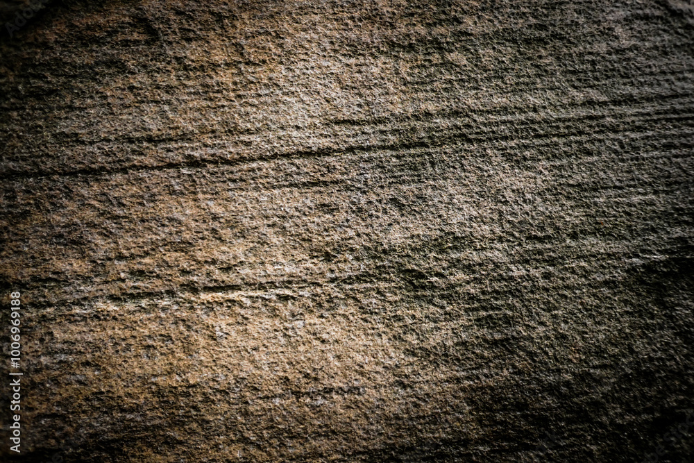 Brown grey bumpy stone wall for abstract background and texture for interior or exterior design. Beautiful patterns, space for work, banner, wallpaper close up.