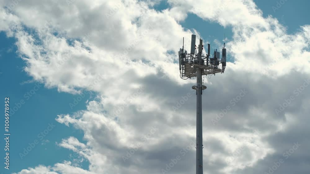 5g mobile network communication tower with cellular antenna transmitter and receiver, broadcasting 4g lte equipment, phone network station on sky with clouds background 4k 5g mobile network communication tower with cellular antenna transmitter and receiver, broadcasting 4g lte equipment, phone network station on sky with clouds background 4k
