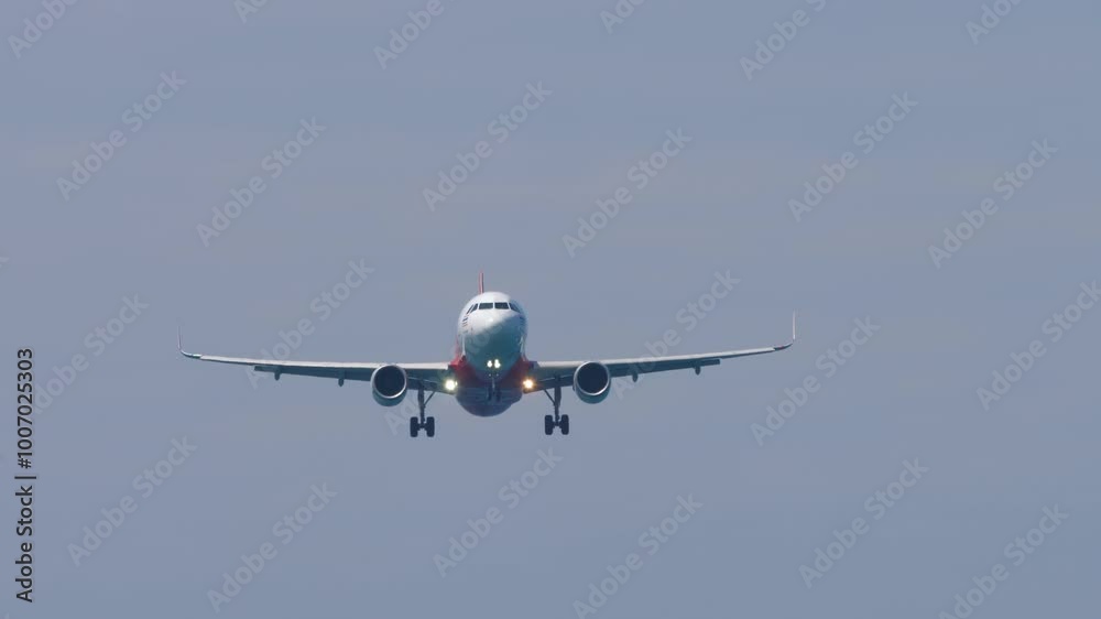 Jet passenger plane approaching landing. Airliner in the sky. Travel concept. Spotting Jet passenger plane approaching landing. Airliner in the sky. Travel concept. Spotting