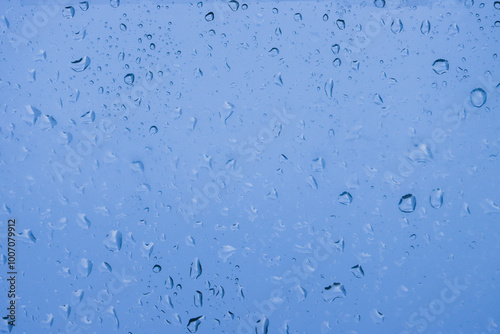 Abstract background on wet glass.