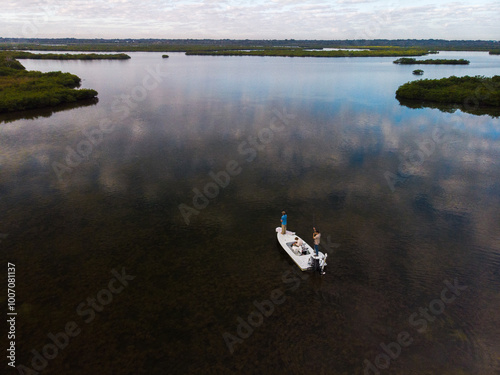 Фотография Polling a skiff drone shot