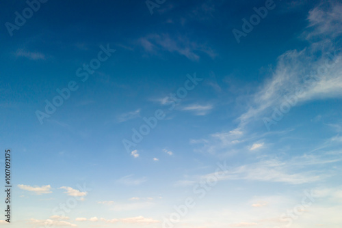 Clear blue sky with soft clouds, creating a serene and peaceful atmosphere. Perfect for nature or background use.