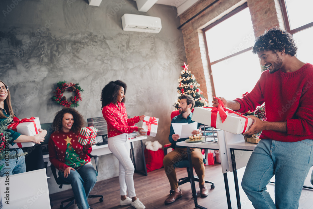 Fototapeta premium Photo of corporate friends workers congratulate xmas giftbox each other atmosphere office party indoors