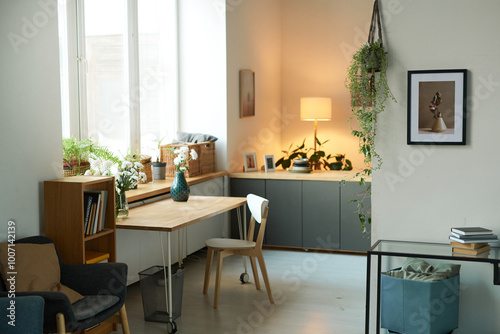 Background image of cozy home interior decorated with green plants and pictures on wall, simple apartment setting photo