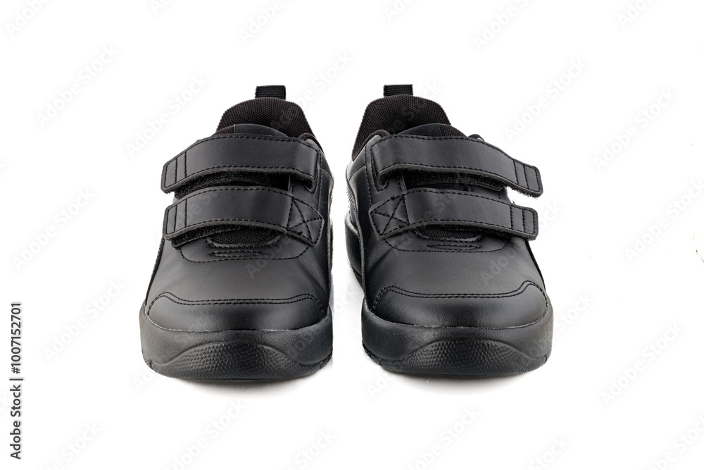 Naklejka premium Sports shoes. Black sneakers on a white background. Close-up. Full depth of field.