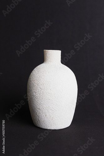 white vase on black