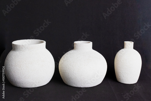 three white ceramic vase