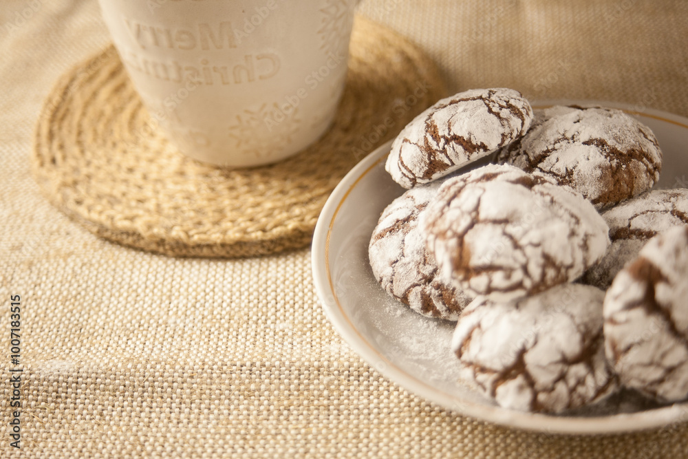 Fototapeta premium Chocolate cookies and a cup of milk on the table, a sweet dessert.