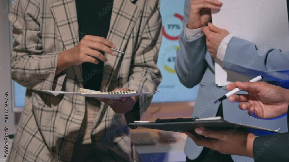 Business people engage in a conversation about documents, showcasing hands gesturing and emphasizing key points Business people engage in a conversation about documents, showcasing hands gesturing and emphasizing key points