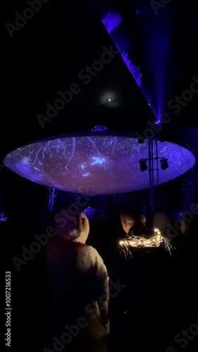 People are dancing during open-air rave