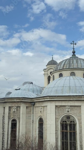 Seagulls are flying near the orthodox church in Istanbul