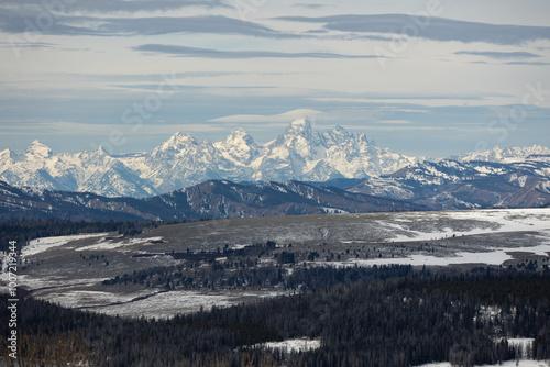 Expansive Winter Mountain Range Landscape with Snow-Capped Peaks and Rolling Hills