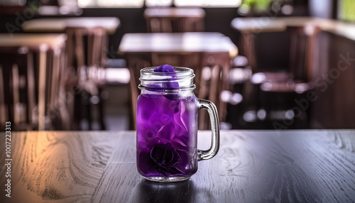 Mocktail in a glass jar on black gradient restaurant background